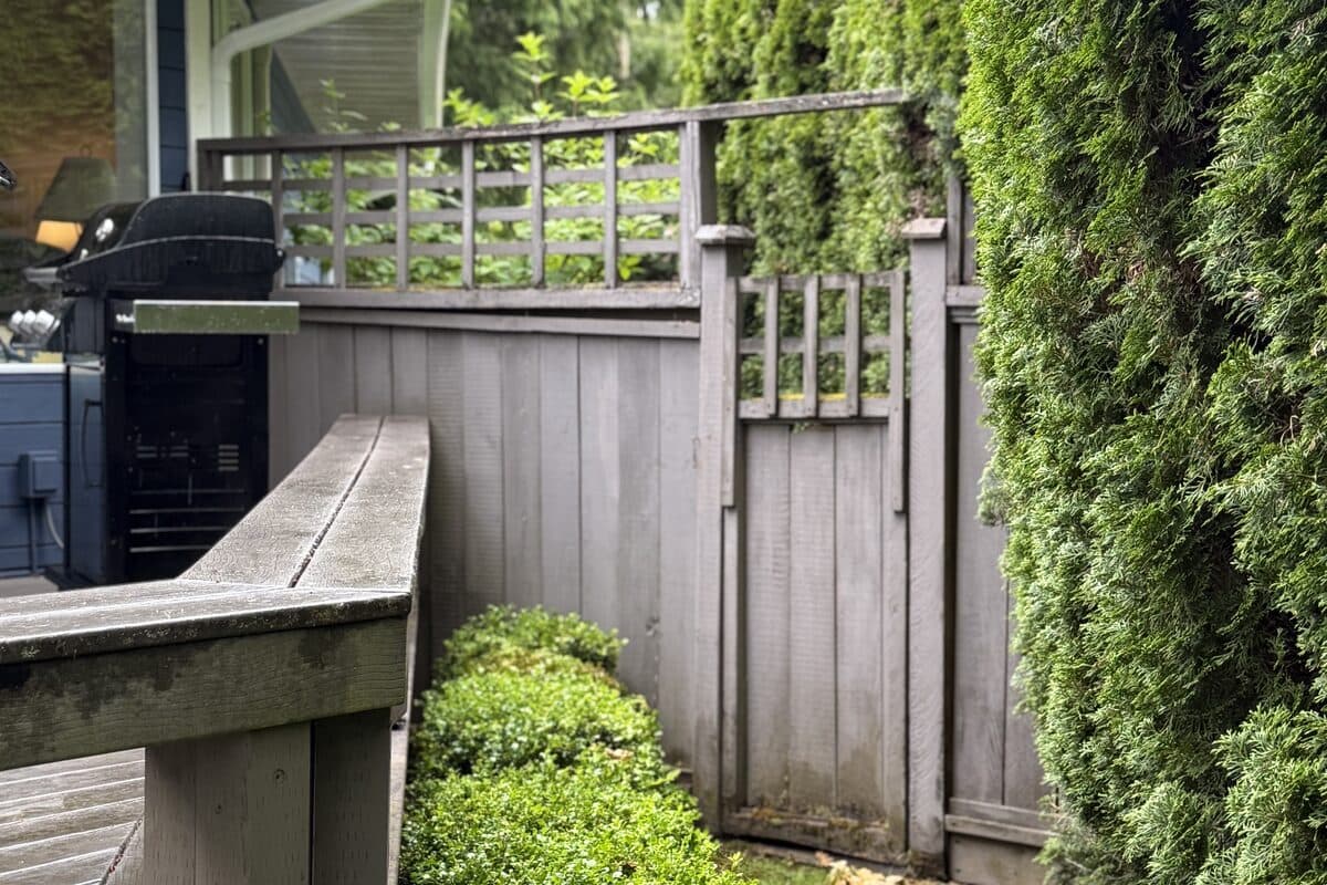 Existing wood semi-privacy fence before replacement