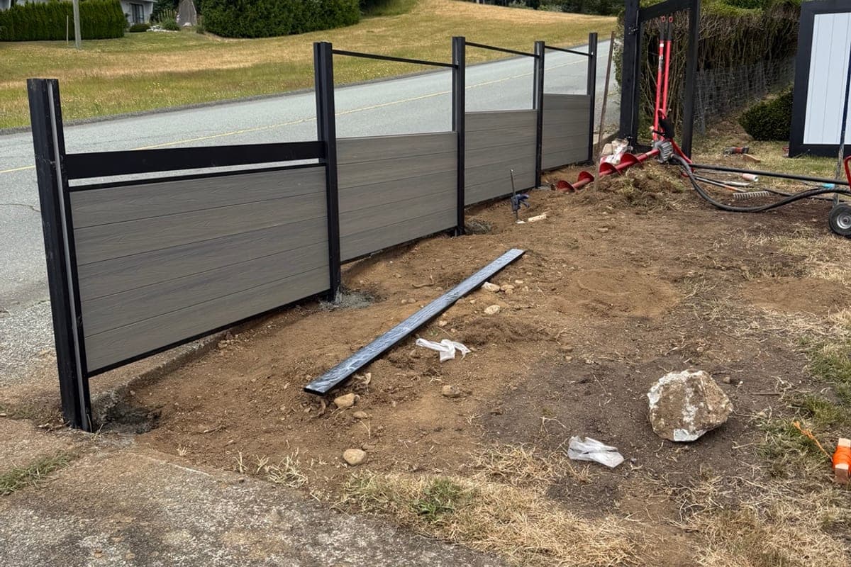 Wide view of ProLine fence installation along property line