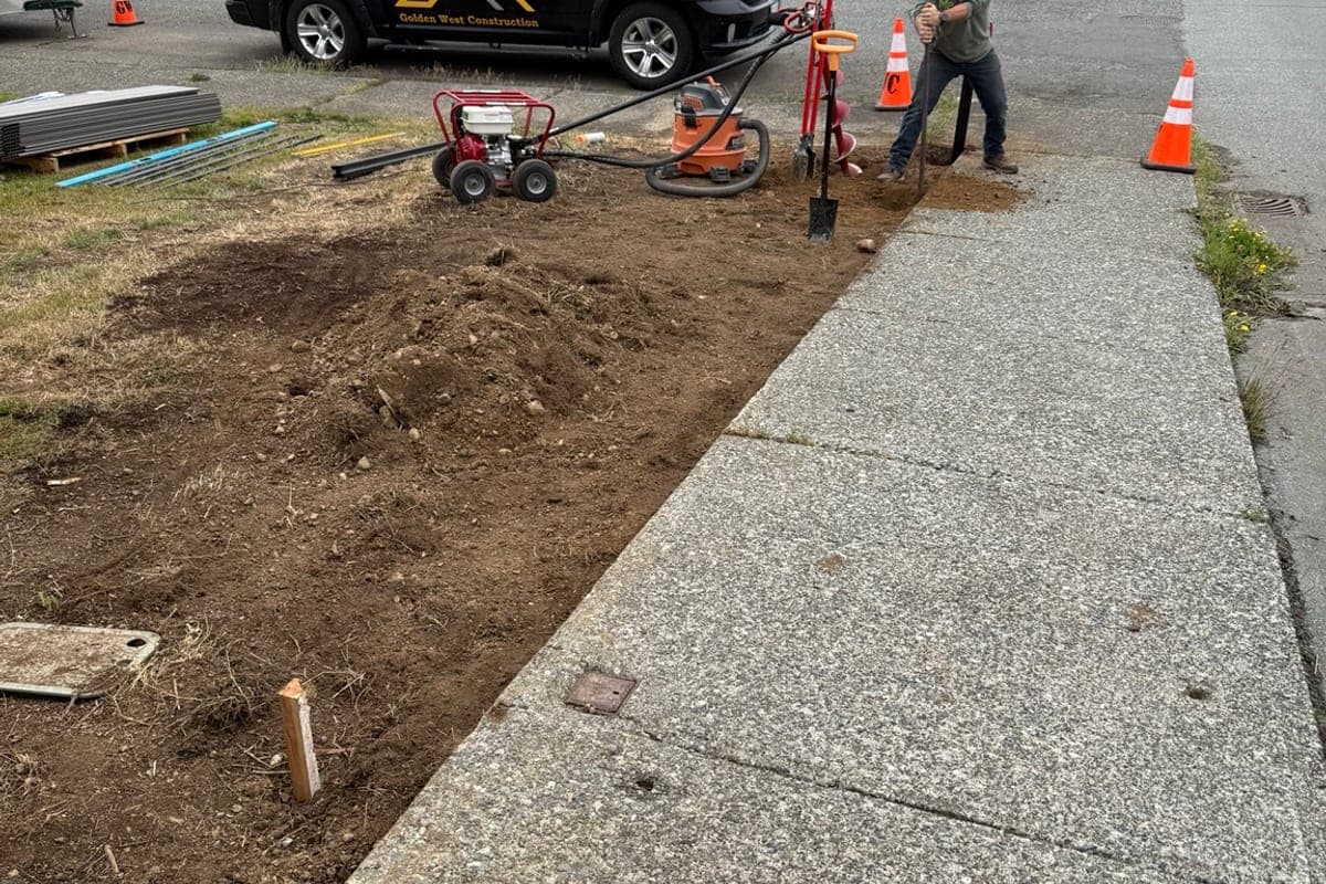 Golden West Construction crew working on site with equipment